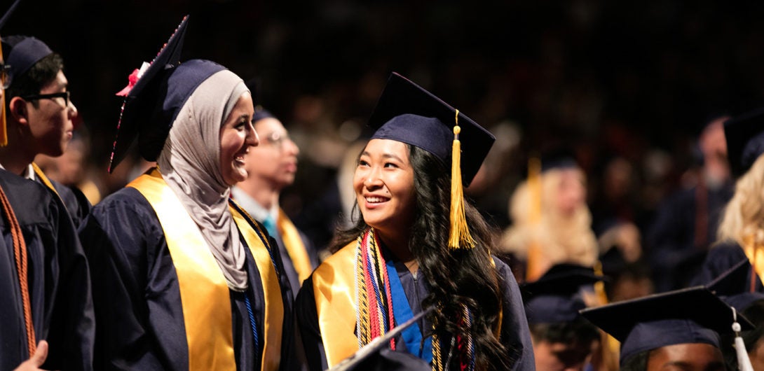 Students smiling at graduation
