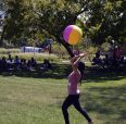 A student bouncing a beach ball.