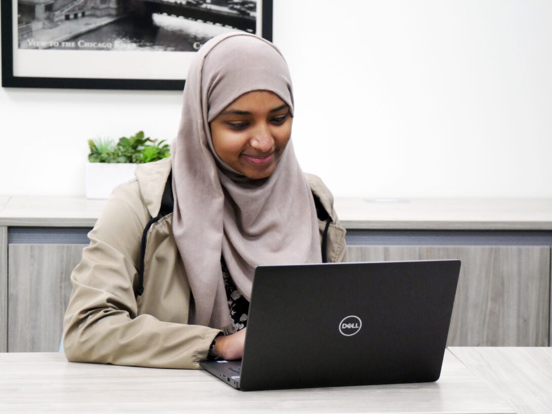 Student writing an email on a computer