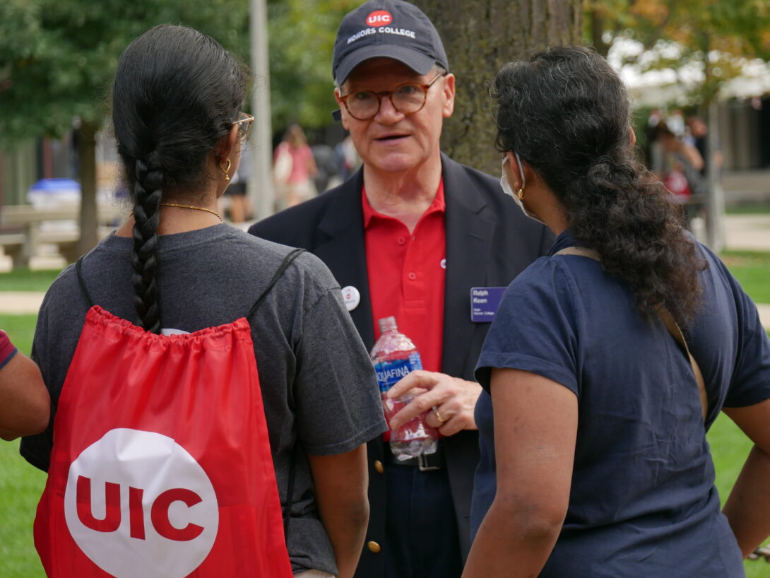 Dean standing with students