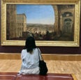 Student staring at art