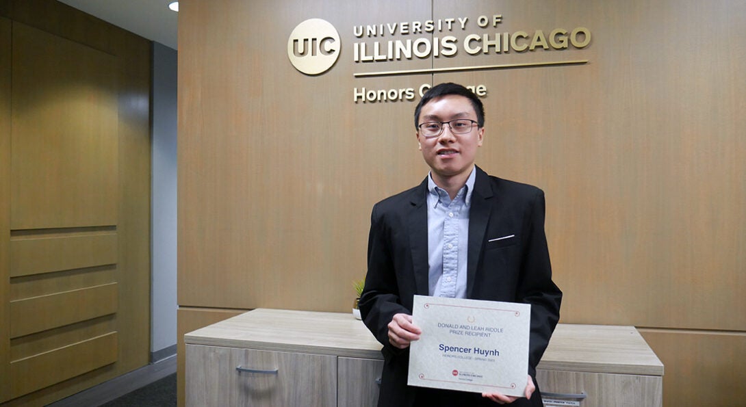 Student holding a certificate