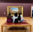 Students staring at art work
