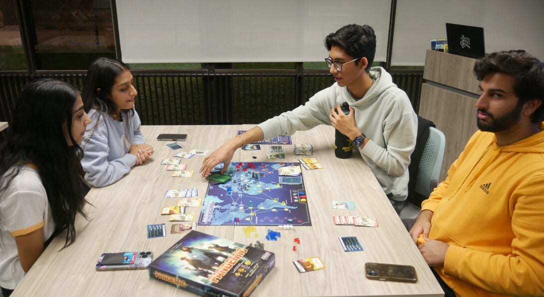 Students playing a board game