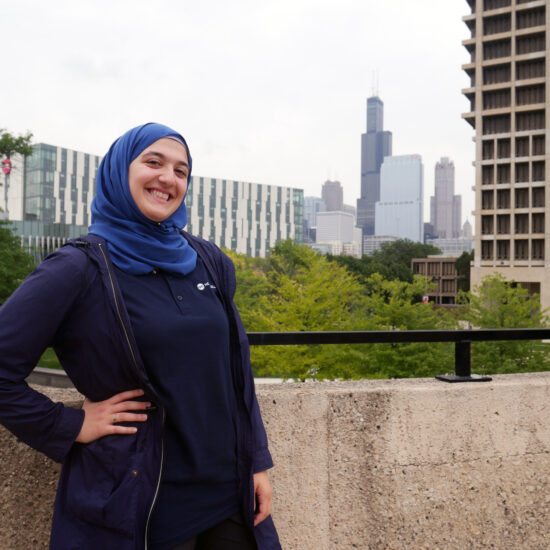 Student standing with Chicago background