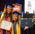 Students holding their diploma