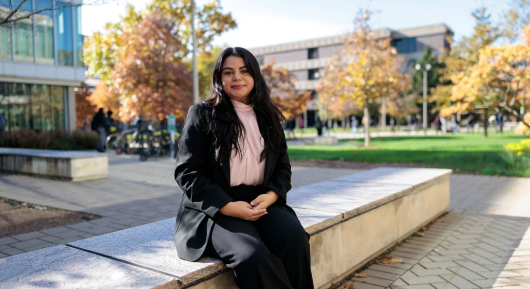 Student sitting outside on UIC campus