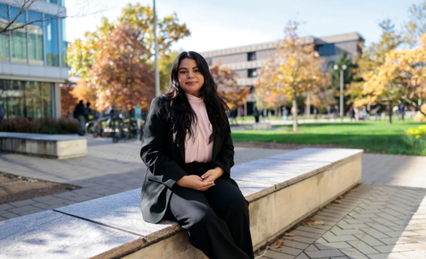 Student sitting outside on UIC campus