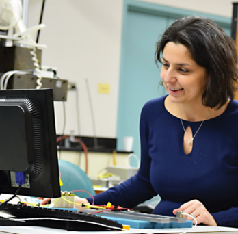 Fellow at a computer in a lab 