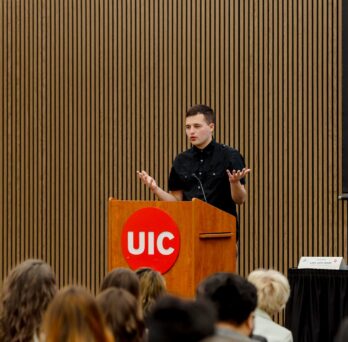 Student speaking at UIC podium 