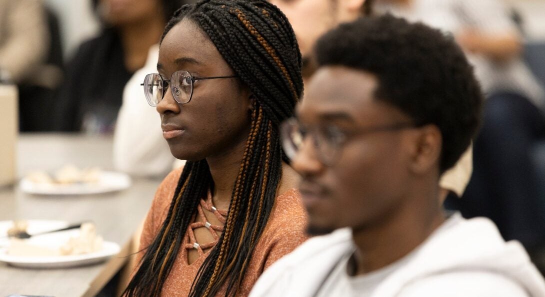 Awardee student sitting at a table