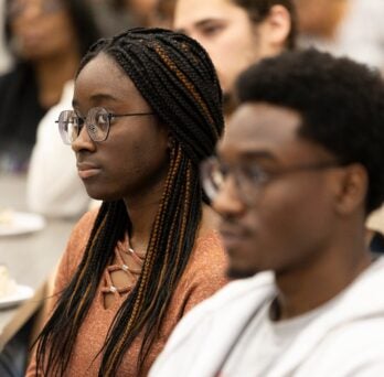 Awardee student sitting at a table 