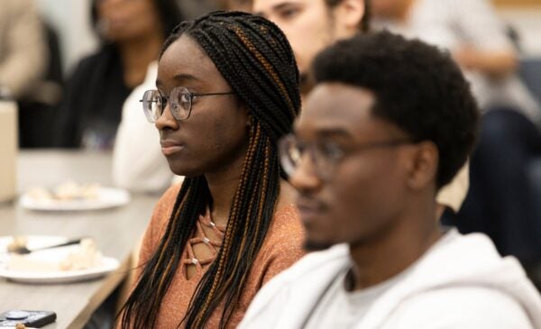 Awardee student sitting at a table